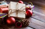 Gift And Balls On A Wooden Stock Photo