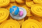 Piggy Bank With Globe And Gold Coins Stock Photo