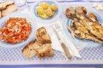 Grilled European Seabass With Potato And Tomato Salad Stock Photo