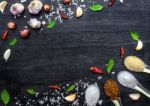 Top View Of Food Ingredients And Condiment On The Table, Ingredients And Seasoning On Dark Wooden Floor Stock Photo