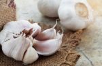 Garlic On Old Floor Stock Photo