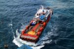 Supply Boat Transfer Cargo To Oil And Gas Industry Stock Photo