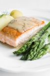 Grilled Salmon With Boiled Potatoes And Asparagus On White Plate Stock Photo