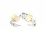 Two Golden Padlocks And Keys On White Stock Photo