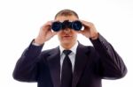 Smart Young Lawyer Viewing Through Binoculars Stock Photo