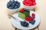 Green Tea Matcha Mousse Cake With Berries Stock Photo