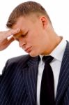 Businessman Holding Head In Tension Stock Photo