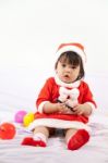 Little Girl With Santa Costume Stock Photo