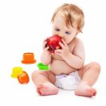 Cute Infant Boy With Apple Stock Photo