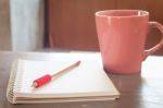 Blank Notebook With Pencil On Grey Background Stock Photo