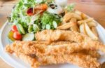 Gourmet Fish And Chips With Salad Stock Photo