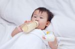 Little Asian Girl Lying  On A Medical Bed Stock Photo