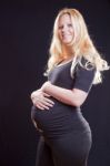 Pregnant Woman Holding Tummy Stock Photo