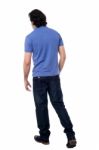 Casual Young Guy Walking In Studio Stock Photo