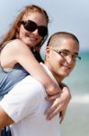 Young Couple Piggybacking Stock Photo