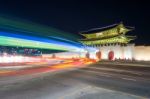 Geyongbokgung Palace And Car Light At Night In Seoul, South Korea Stock Photo