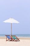 Beach Chairs And White Umbrella Stock Photo