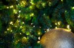 Close Up Big Yellow Glitter Ball Christmas On Tree With Wire White Light Background Stock Photo