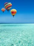 Hot Air Balloons Travel Over The Sea Stock Photo