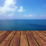 Ocean With Sky And Wood Floor Stock Photo