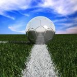 Silver Soccer Ball In Grass Stock Photo