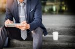 Asian Indian Businessman Using Tablet Pc Outdoors, Golden Sunlig Stock Photo