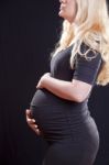 Pregnant Woman Holding Tummy Stock Photo