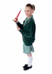 School Girl Holding Big Pencil Stock Photo