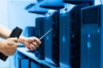 Man Fix Server Network In Data Center Room Stock Photo