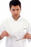 Chef Holding Knife And Fork Stock Photo