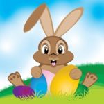 Easter Bunny With Colorful Egg. Little Gift At Easter. Easter Eggs On The Meadow And A Beautiful Sky Stock Photo