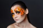 Orange And Red Rhinestones On A Girl Face Stock Photo