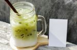 Iced Green Tea Latte With Blank Name Card Stock Photo