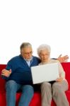 Elderly Couple With Laptop Stock Photo