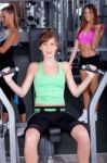 Fit Woman Working Out At Gym Stock Photo