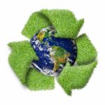 Recycle Logo Symbol From The Green Grass And Earth Stock Photo