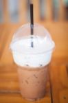 Iced Mocha Coffee In Glass On The Table Stock Photo