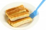 Bread Stick In White Disk With Blue Plastic Fork Dip Stock Photo