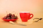 Beautiful Breakfast Of Red Coffee Cup And Cherries Stock Photo