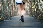 Woman Walking On Wooden Bridge. Vintage Tone Stock Photo