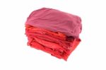 Pile Of Red Shade Cloths On White Background Stock Photo