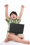 Little Boy With Laptop Stock Photo