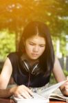 Asian Teen Student Reading Book Preparing For Exam  Stock Photo