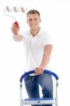 Front Pose Of Smiling Male Holding Brush Stock Photo