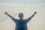 Shadow Man On Beach Stock Photo