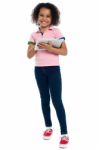 Primary Child With A Tablet Pc Smiling Cheerfully Stock Photo