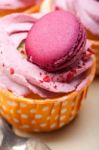 Pink Berry Cream Cupcake With Macaroon On Top Stock Photo