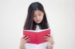 Portrait Of Thai Teen Beautiful Girl Reading Book Stock Photo