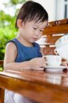 Little Asian Girl (thai) Holding A Cup Stock Photo