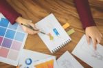 Young Women Working As Fashion Designer Drawing Sketches For Clo Stock Photo